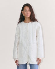 womens-renew-lightweght-midi-quilted-liner-bone | primary